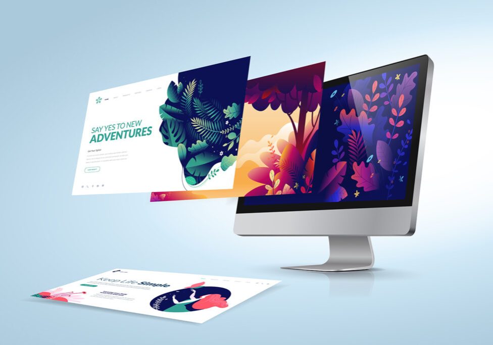 A modern desktop computer displays colorful illustrated website pages with nature and adventure themes, some pages floating off the screen and onto the surface, against a light blue background.